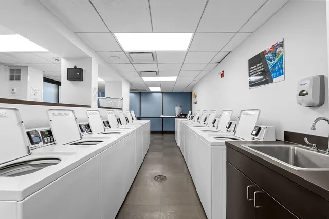 a view of storage and utility room with washer and dryer