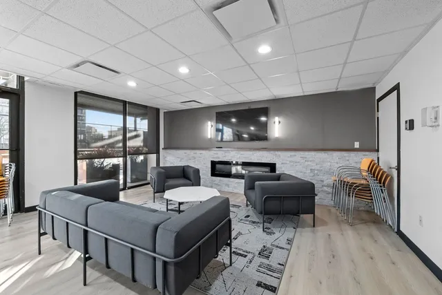 a room with lots of furniture and a flat screen tv