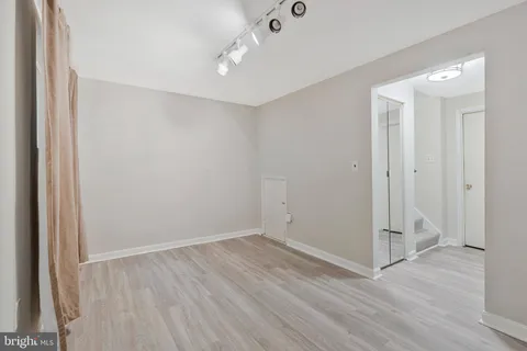 an empty room with wooden floor