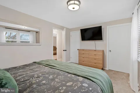 a roof deck with couch and chairs