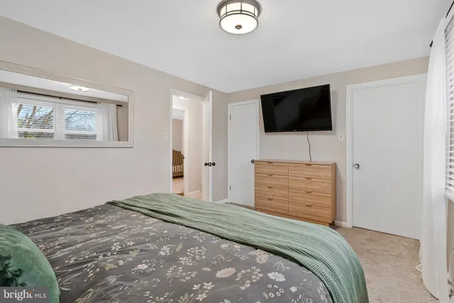 a roof deck with couch and chairs