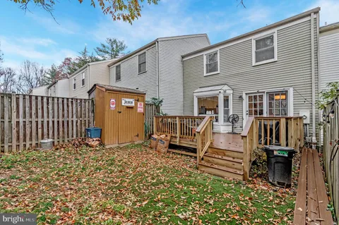 a view of a chairs and a table in the patio