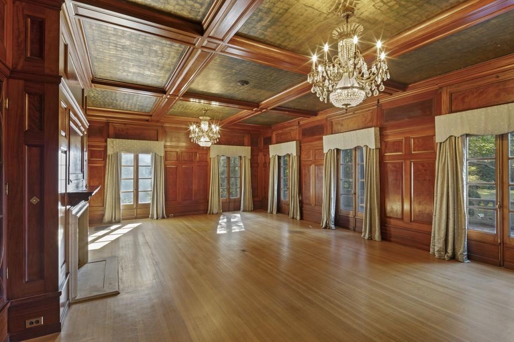 39 Clyde Street Brookline, MA 02467 - Photo 12 of 31 a view of big room with wooden floor and windows