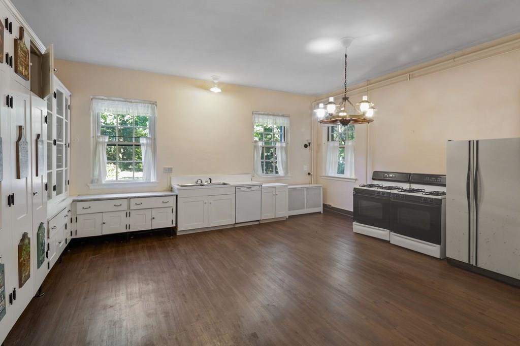 39 Clyde Street Brookline, MA 02467 - Photo 15 of 31 a view of a kitchen with a sink cabinets and wooden floor