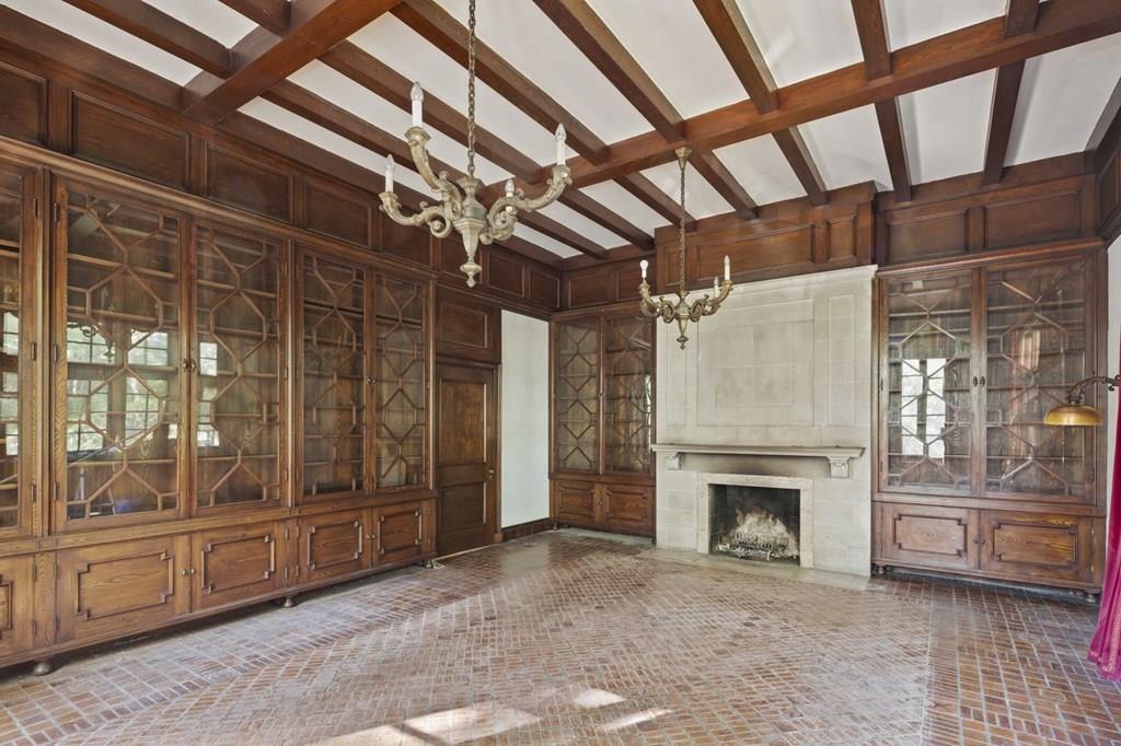 39 Clyde Street Brookline, MA 02467 - Photo 17 of 31 a view of an empty room with a fireplace and a window