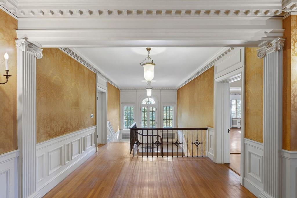 39 Clyde Street Brookline, MA 02467 - Photo 19 of 31 a view of a hallway with wooden floor and windows