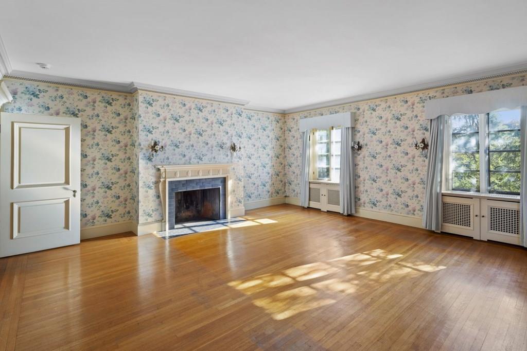 39 Clyde Street Brookline, MA 02467 - Photo 20 of 31 wooden floor fireplace and windows in an empty room