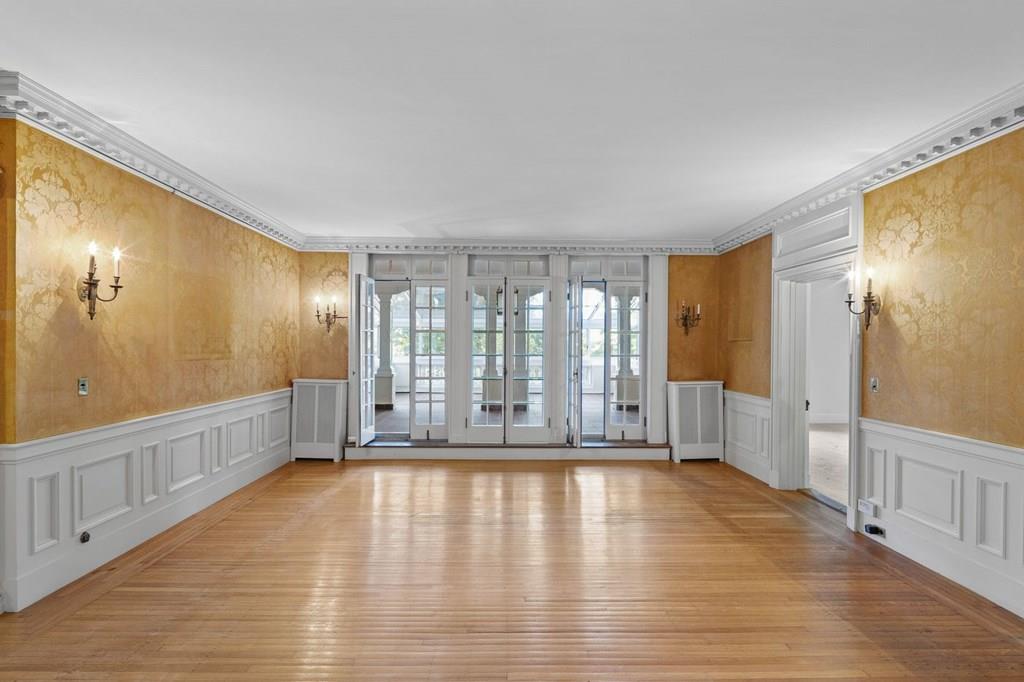 39 Clyde Street Brookline, MA 02467 - Photo 22 of 31 a view of an empty room with wooden floor and a window