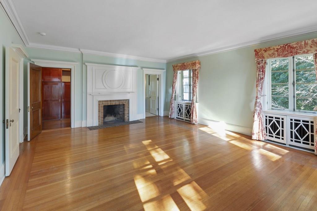 39 Clyde Street Brookline, MA 02467 - Photo 25 of 31 a view of an empty room with glass door and wooden floor