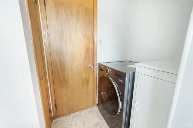 a view of entryway with wooden floor and stairs