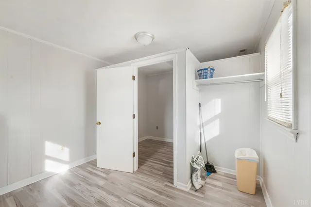 a view of a house with a wooden fence