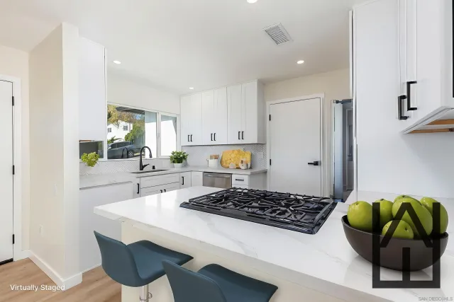 a kitchen with a table and chairs