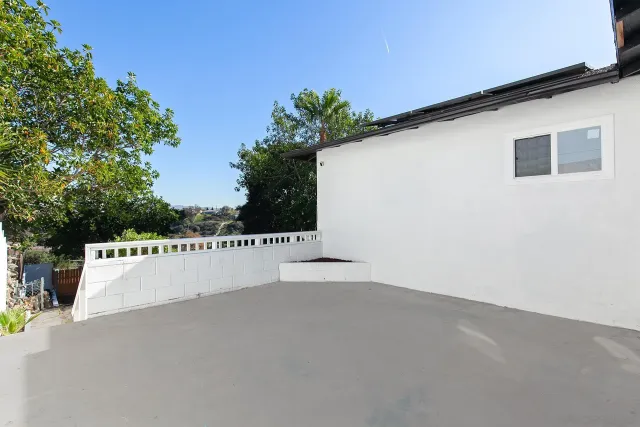 a view of a street with a yard