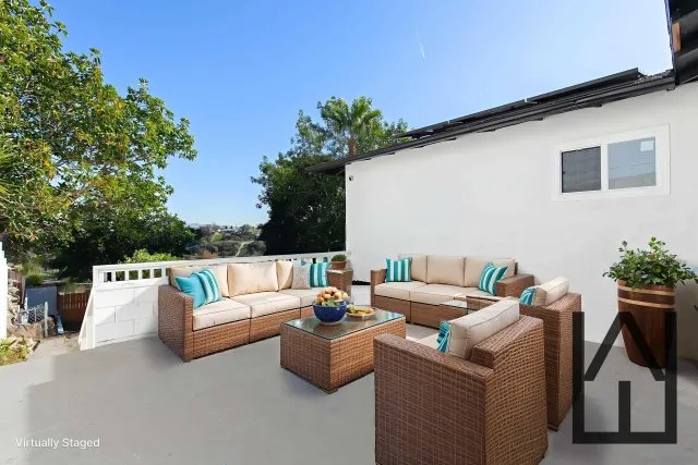 a view of a house with a backyard