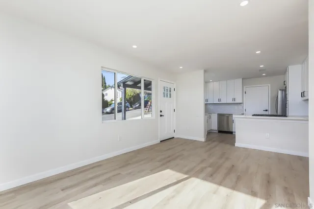 a view of kitchen with window and wooden floor