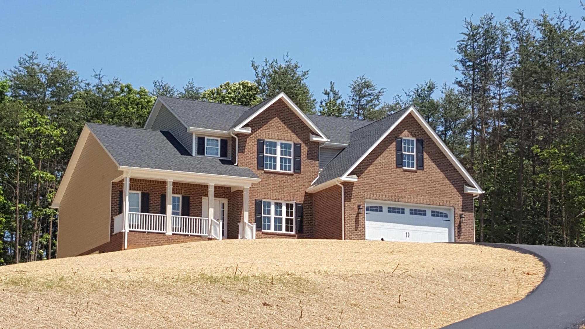 726 Thornblade Way Blue Ridge, VA 24064 - Photo 1 of 27 a front view of a house with a yard and garage