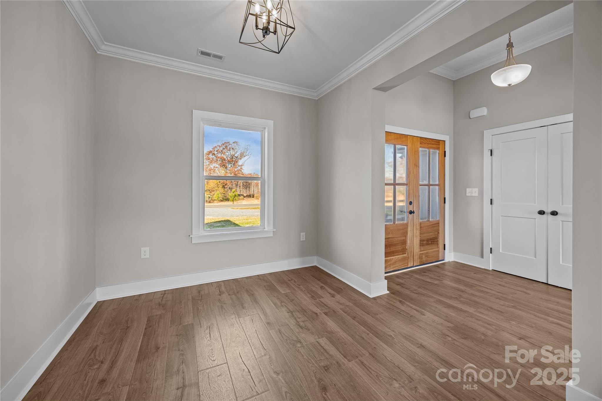 17826 Brattain Road Locust, NC 28097 - Photo 15 of 44 an empty room with wooden floor closet and windows