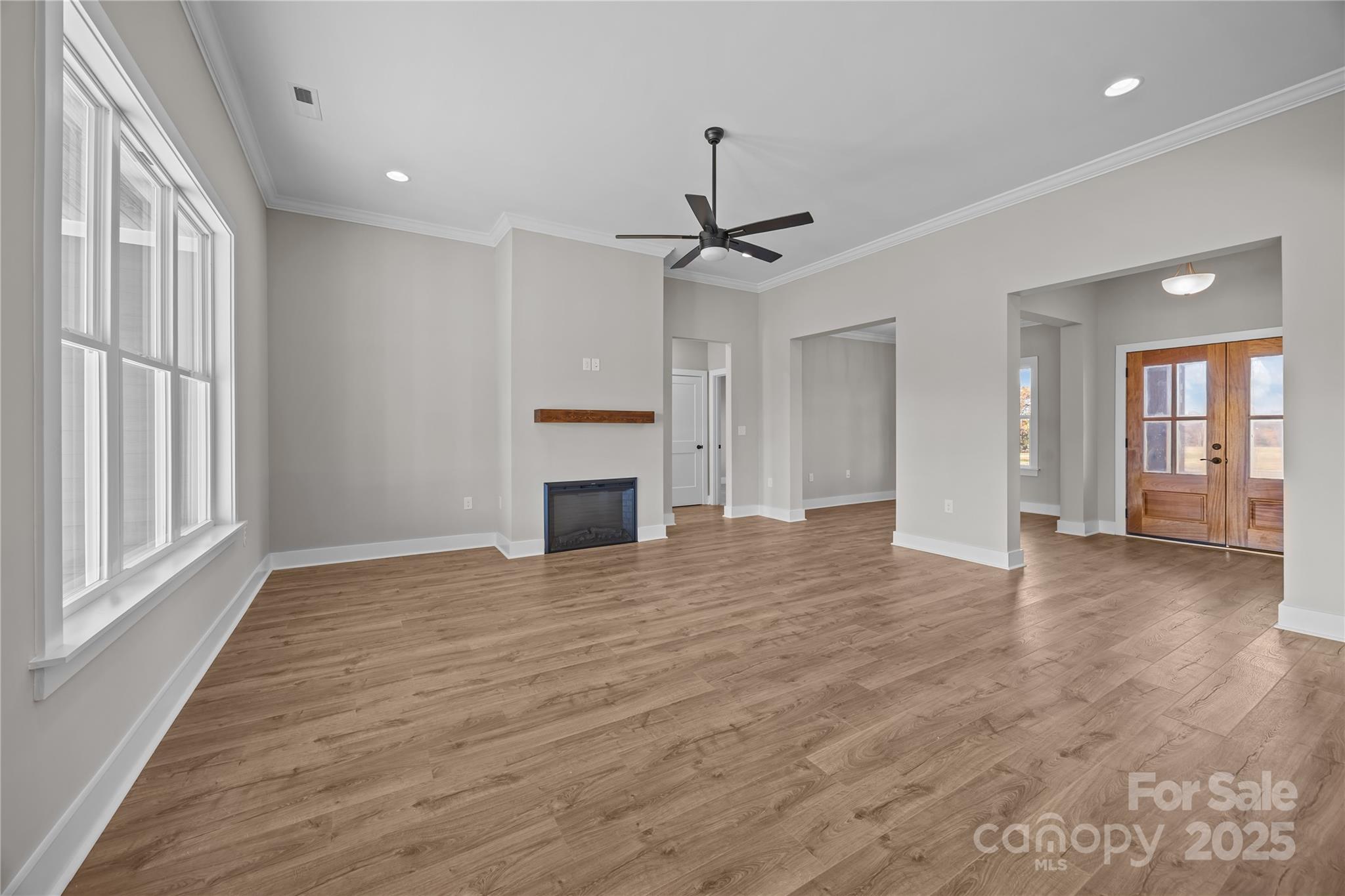 17826 Brattain Road Locust, NC 28097 - Photo 17 of 44 a view of empty room with wooden floor and fireplace