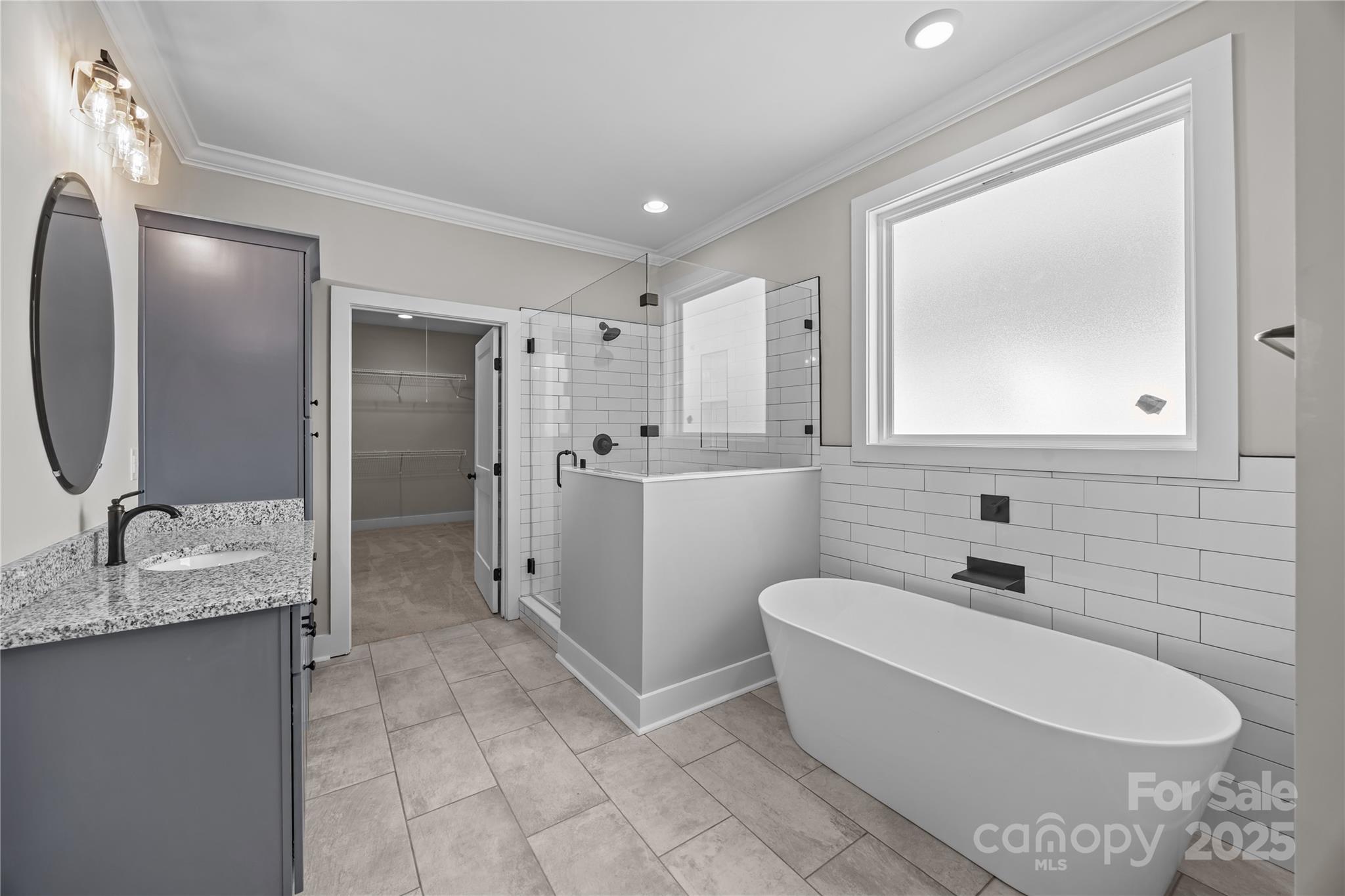 17826 Brattain Road Locust, NC 28097 - Photo 28 of 44 a bathroom with a granite countertop sink toilet and mirror