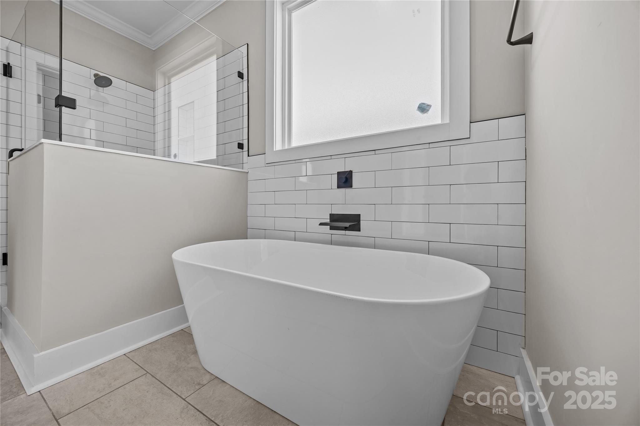 17826 Brattain Road Locust, NC 28097 - Photo 29 of 44 a white bath tub sitting in a bathroom