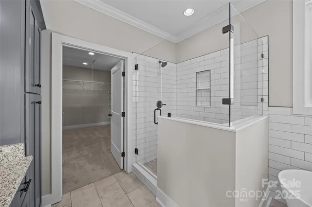 a bathroom with a granite countertop sink a mirror and a toilet