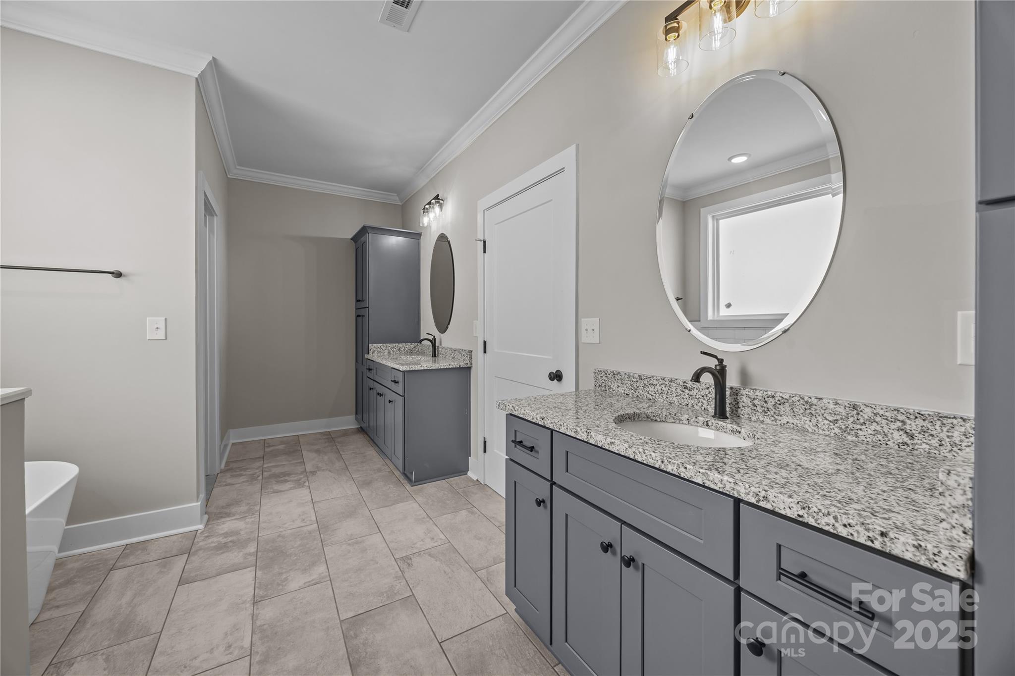 17826 Brattain Road Locust, NC 28097 - Photo 31 of 44 a bathroom with a granite countertop sink a mirror and a toilet