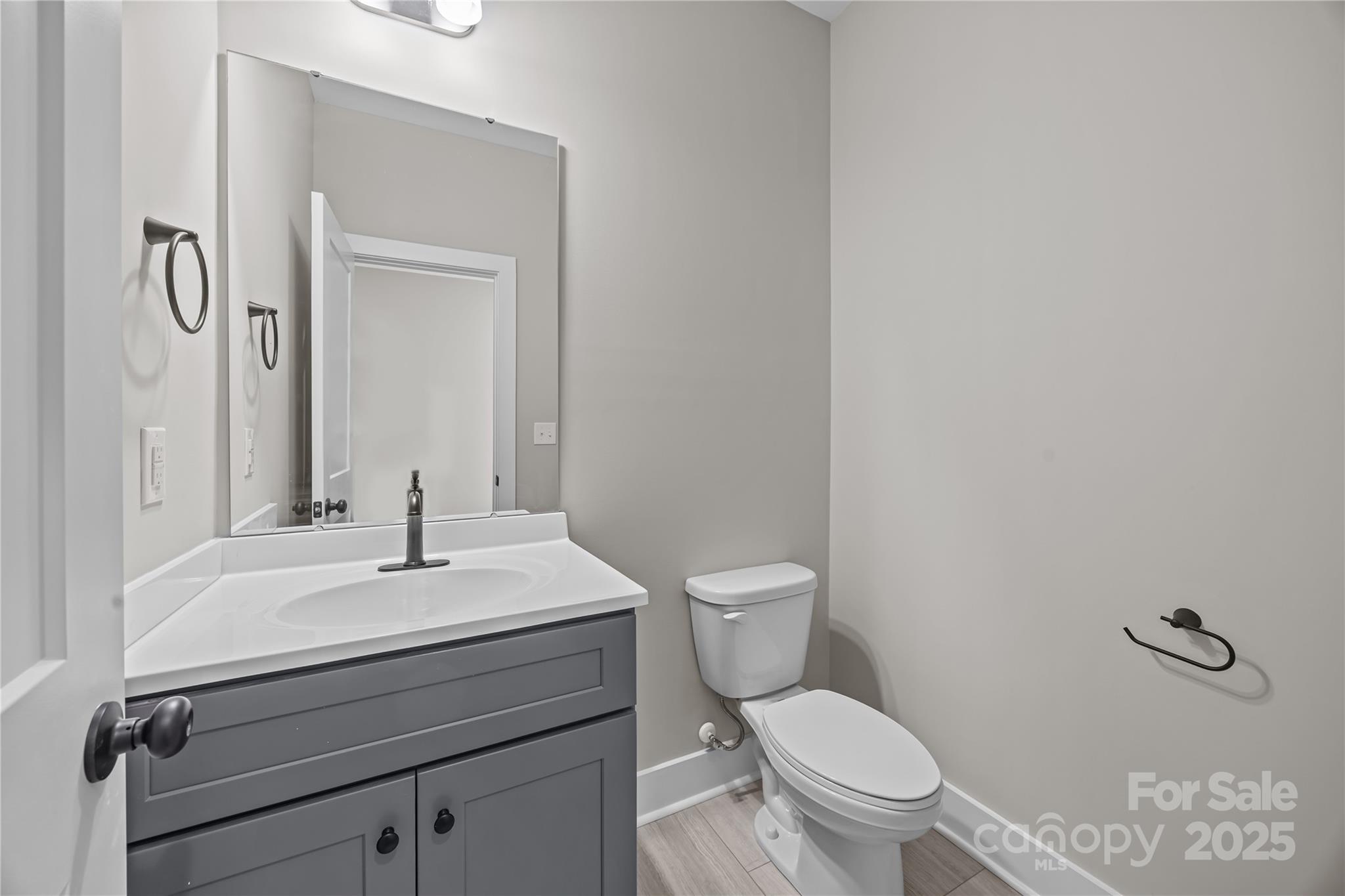 17826 Brattain Road Locust, NC 28097 - Photo 35 of 44 a bathroom with a sink vanity mirror and toilet