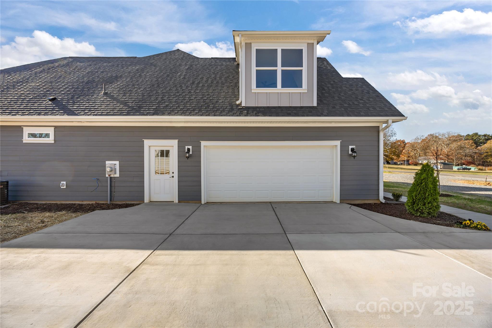 17826 Brattain Road Locust, NC 28097 - Photo 4 of 44 a front view of a house with a garage