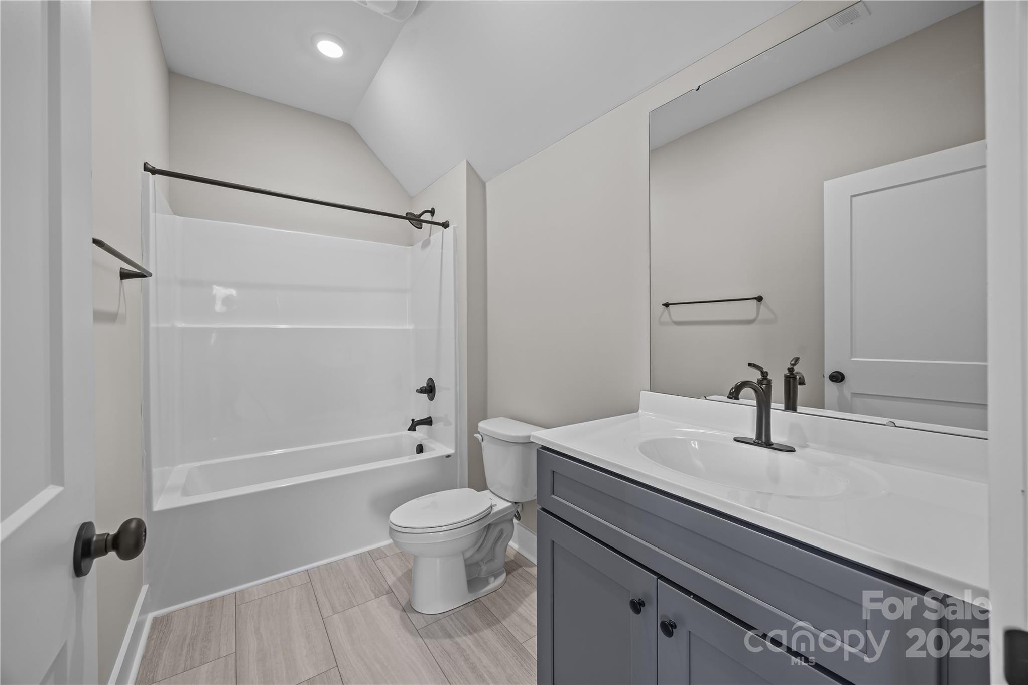 17826 Brattain Road Locust, NC 28097 - Photo 44 of 44 a bathroom with a sink a toilet and shower