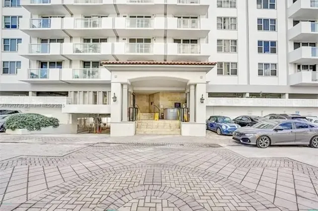 a front view of a building with glass windows