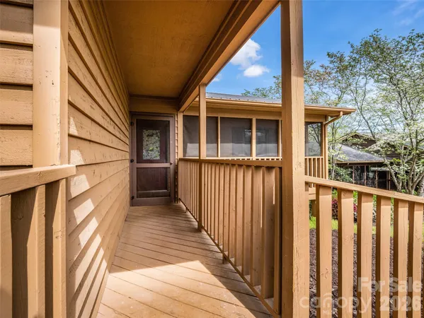 a view of a house with wooden fence