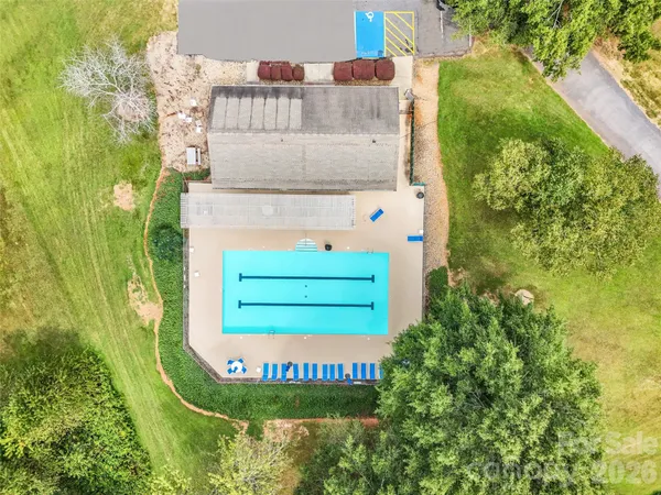 a view of a swimming pool and an outdoor seating
