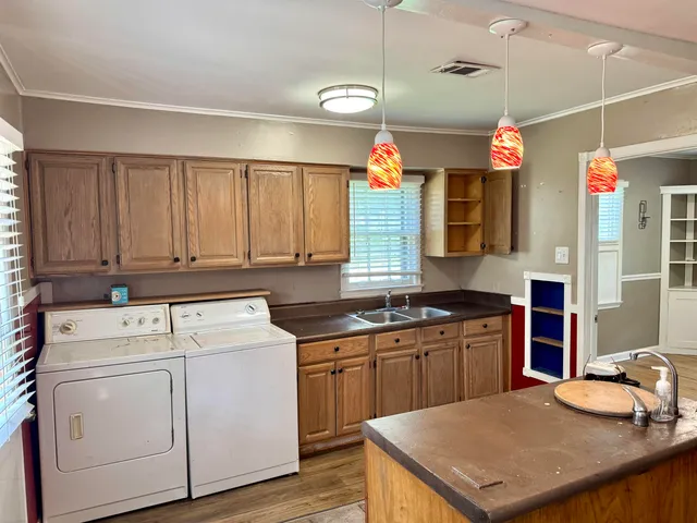 a kitchen that has a cabinets and a stove