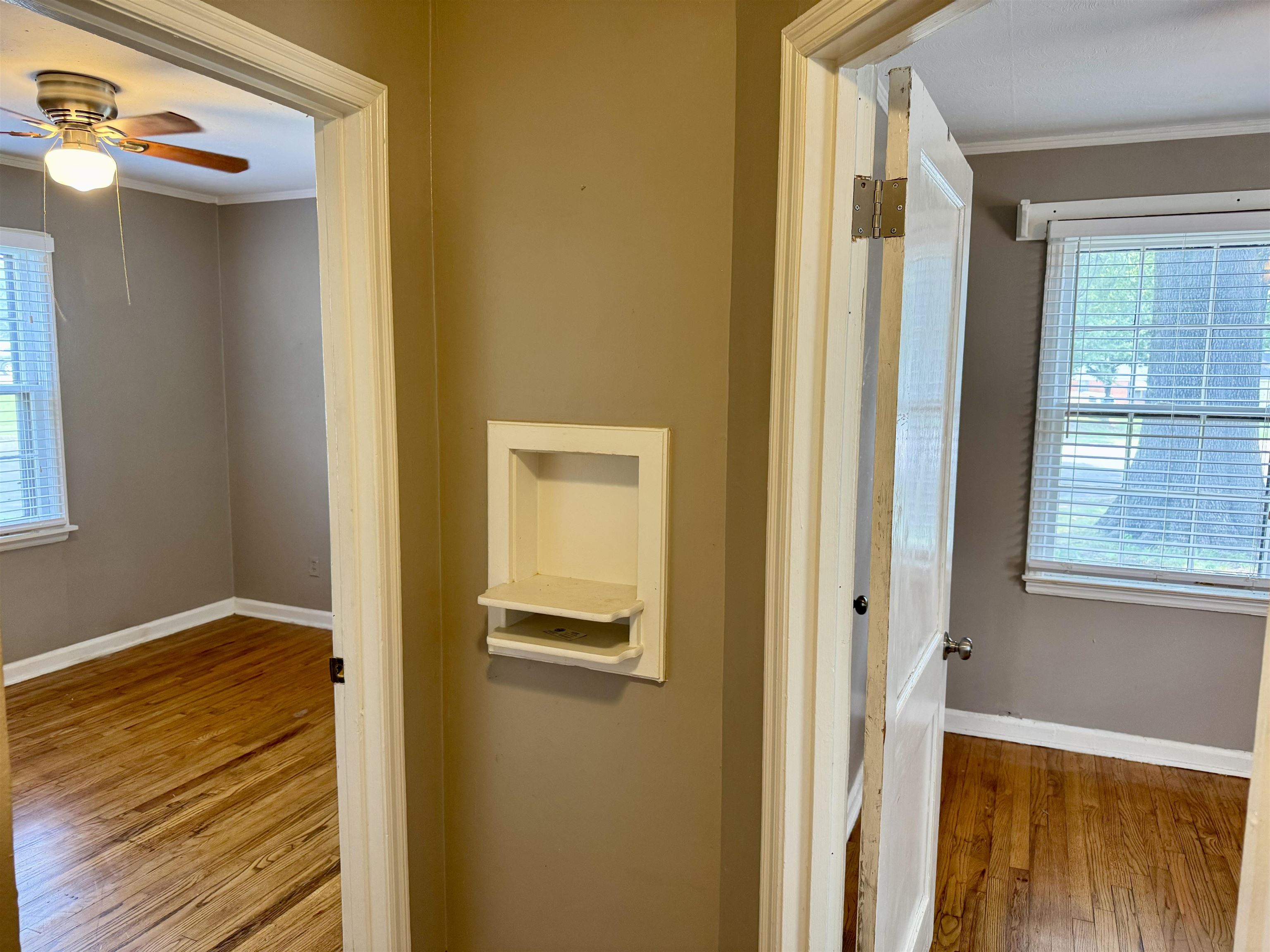 3787 Rhodes Avenue Memphis, TN 38111 - Photo 15 of 23 a view of a hallway with wooden floor and closet
