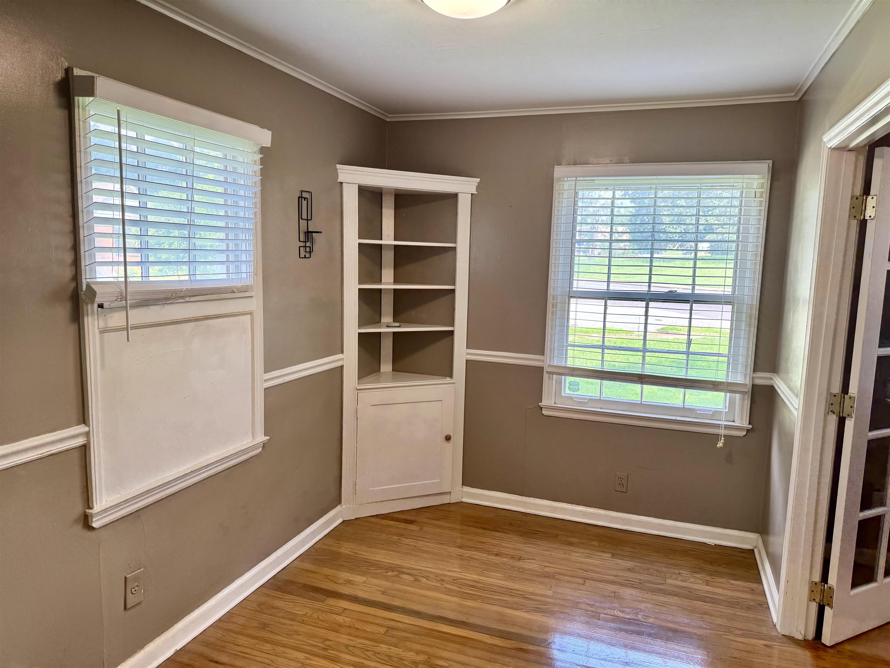 3787 Rhodes Avenue Memphis, TN 38111 - Photo 23 of 23 a view of an empty room with wooden floor and a window