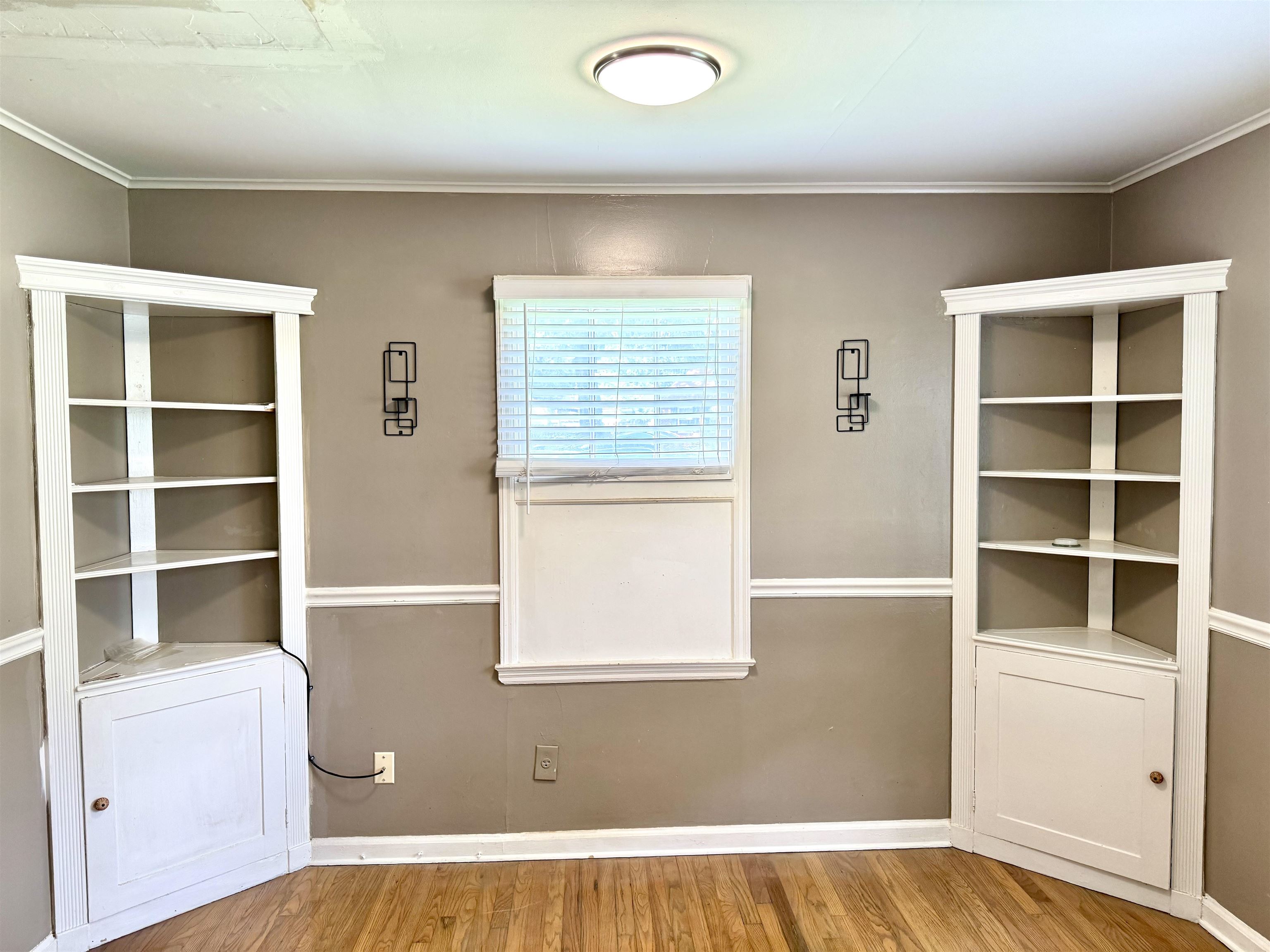 3787 Rhodes Avenue Memphis, TN 38111 - Photo 4 of 23 a view of an empty room with a window and cabinet