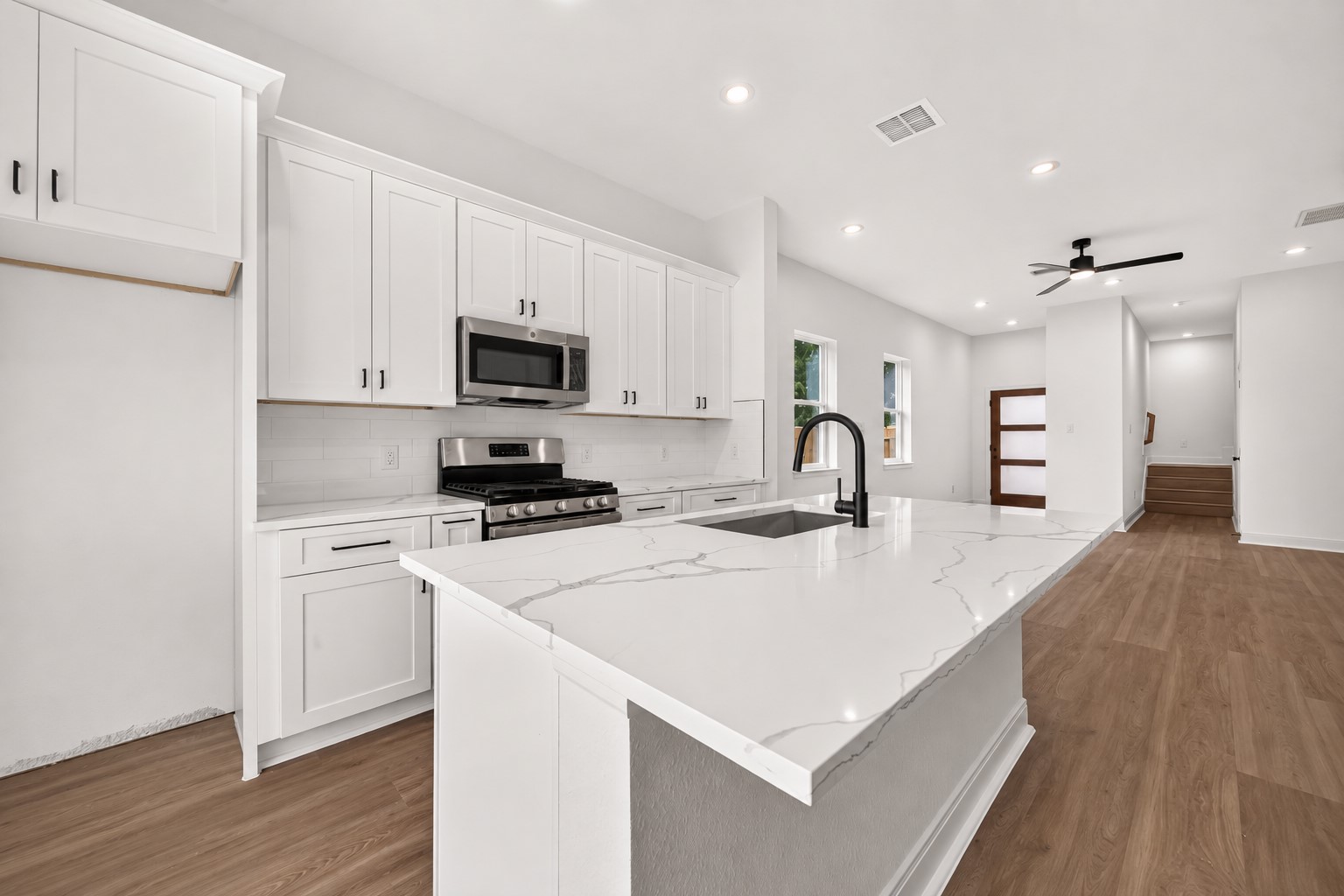 8110 Carver Road Houston, TX 77088 - Photo 10 of 38 Bright, functional kitchen with generous cabinetry, plenty of workspace, and an open connection to the living area.