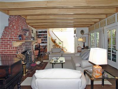 191 Lagunitas Road Ross, CA 94957 - Photo 4 of 11 a living room with furniture and a painting on the wall