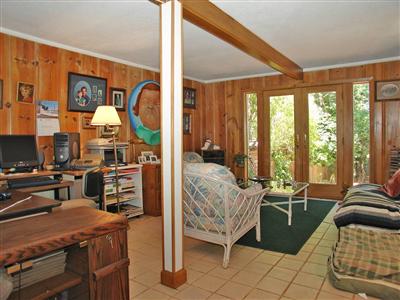 191 Lagunitas Road Ross, CA 94957 - Photo 9 of 11 a bedroom with furniture and a large window