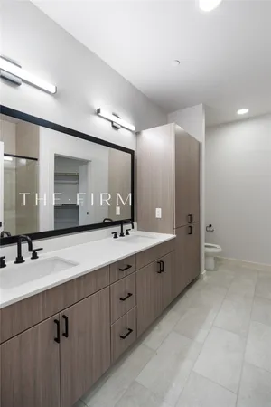 a bathroom with a double vanity sink mirror and double