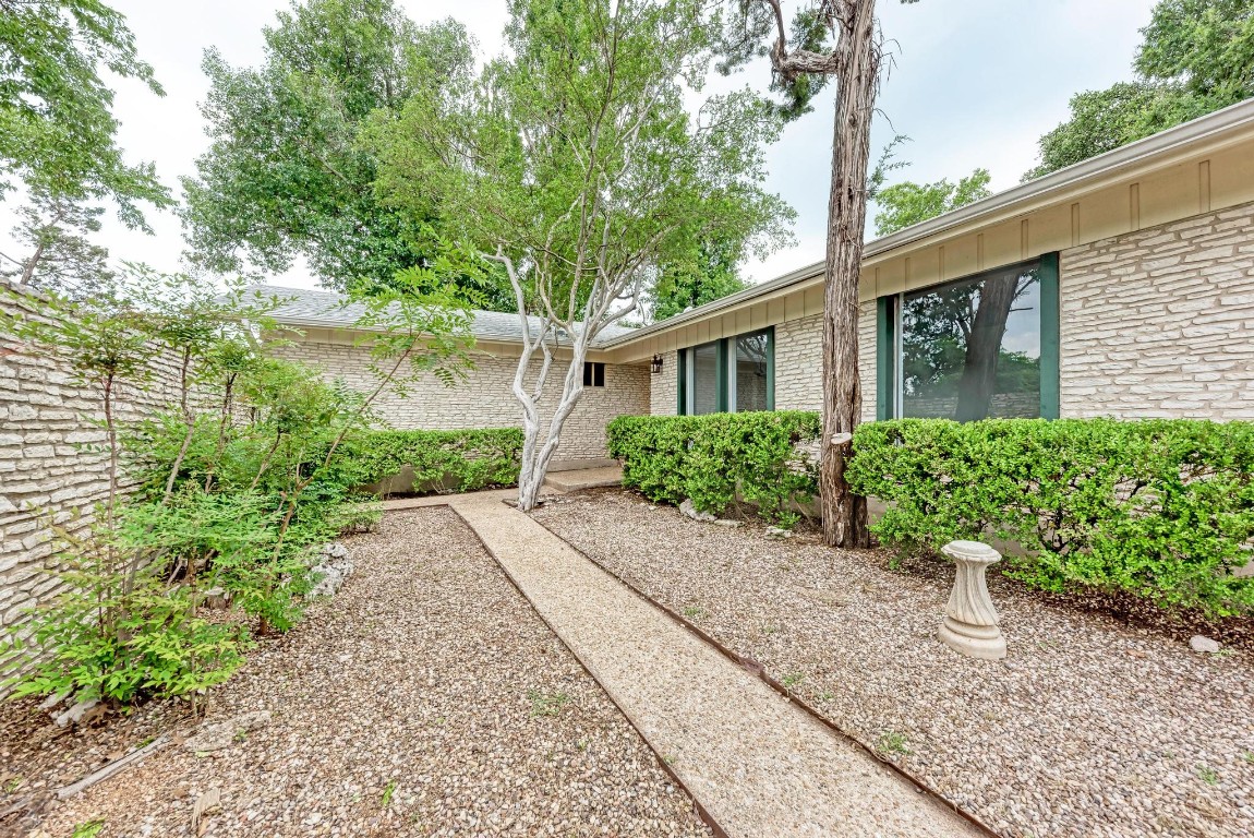 a house view with a garden space