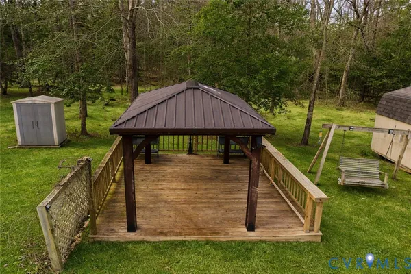 a view of a deck with a table and chairs