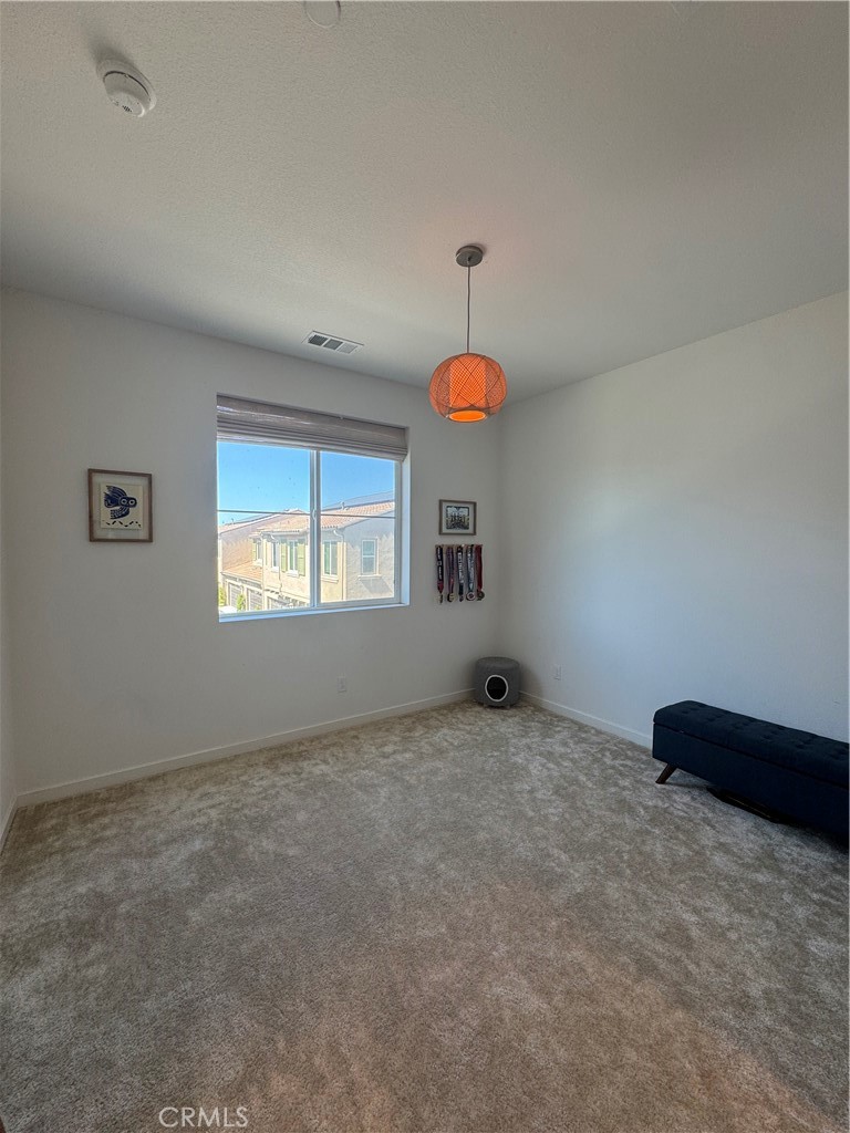 32412 Tannat Drive Temecula, CA 92591 - Photo 14 of 28 a view of an empty room with a window