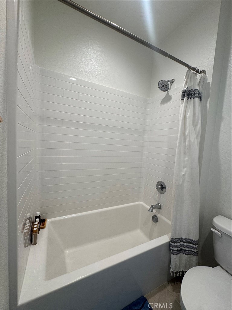 32412 Tannat Drive Temecula, CA 92591 - Photo 17 of 28 a view of a bathroom with a tub and toilet