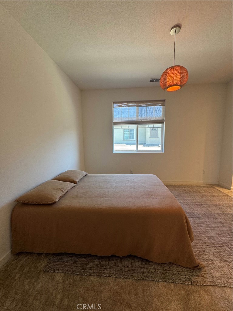 32412 Tannat Drive Temecula, CA 92591 - Photo 18 of 28 a bedroom with a bed and a window