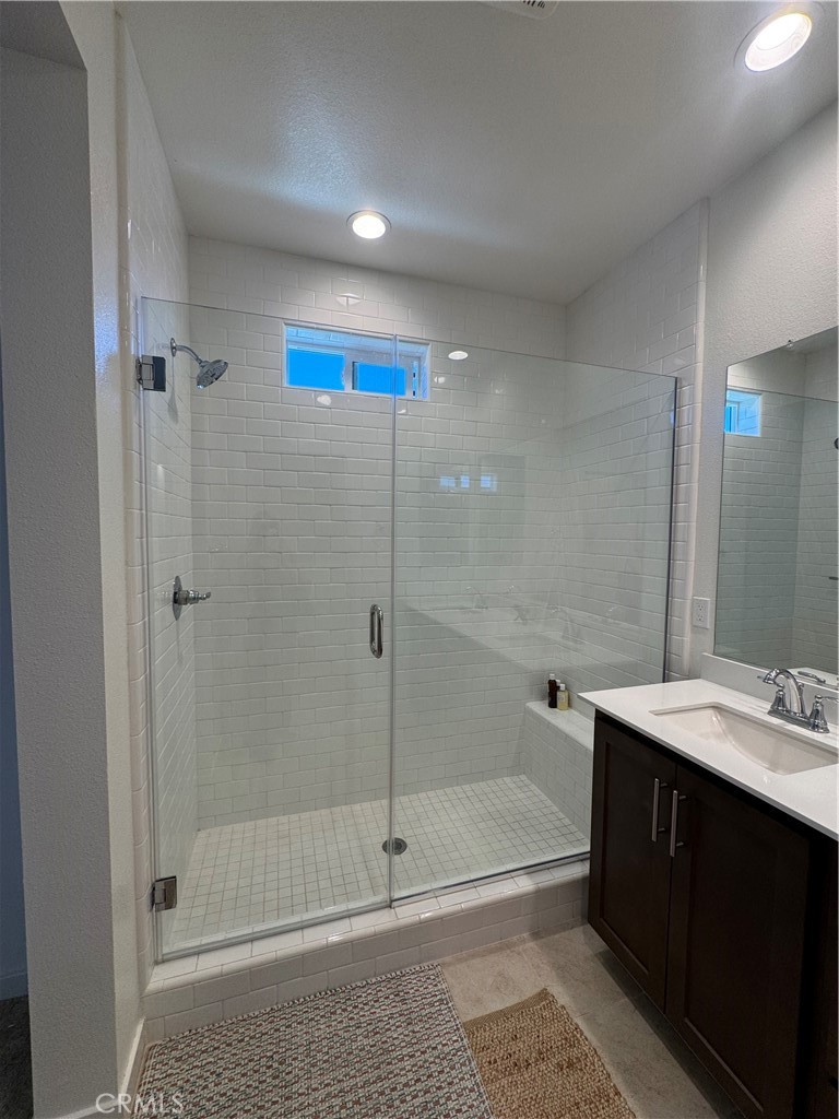 32412 Tannat Drive Temecula, CA 92591 - Photo 20 of 28 a bathroom with a shower and a sink