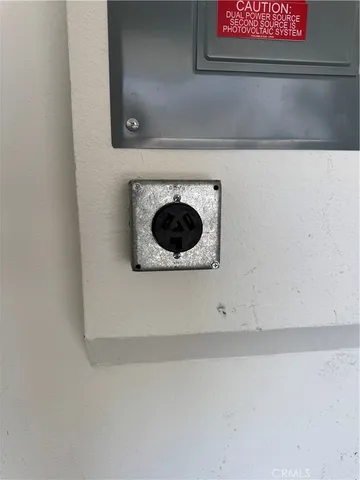 a close view of a utility room with washer and dryer