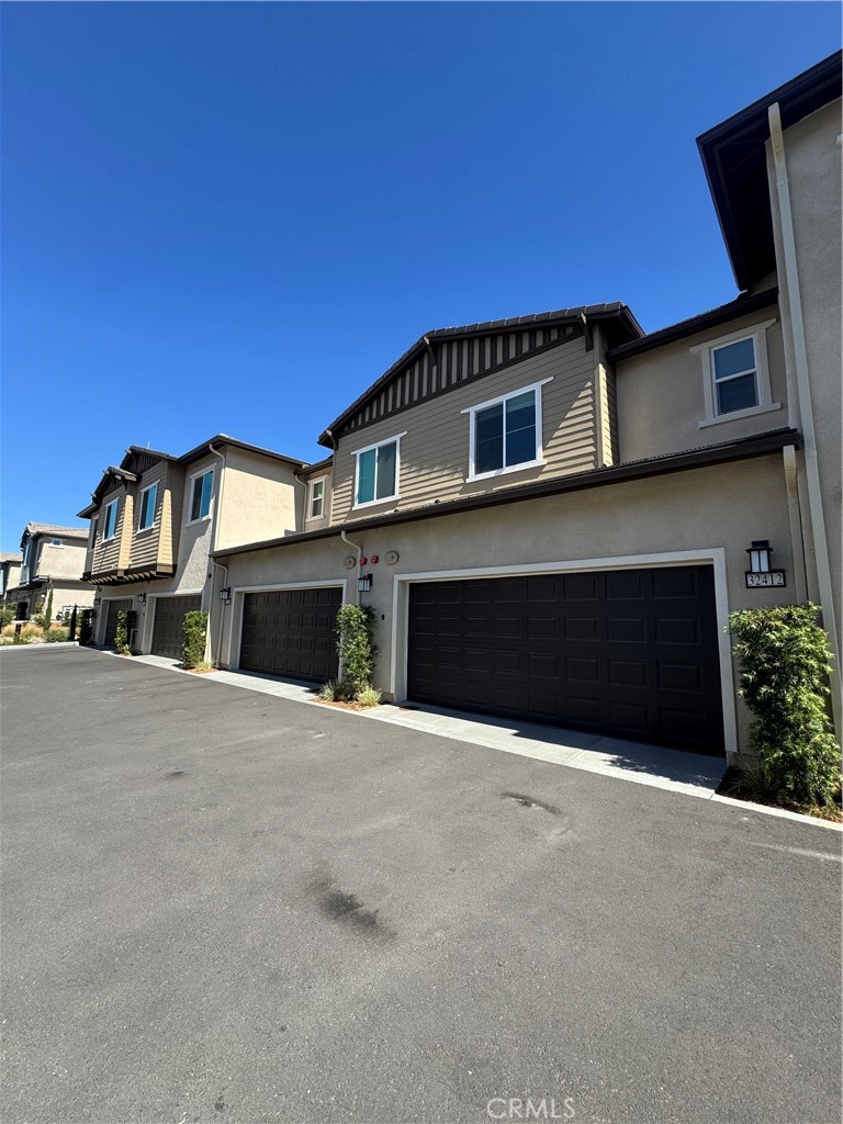 32412 Tannat Drive Temecula, CA 92591 - Photo 28 of 28 a front view of a house with a yard