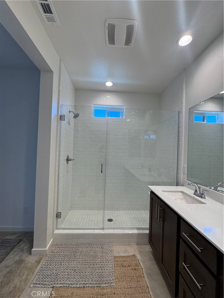 32412 Tannat Drive Temecula, CA 92591 - Photo 3 of 28 a bathroom with a sink a toilet and shower