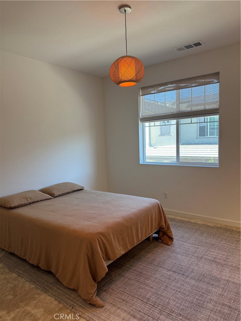 32412 Tannat Drive Temecula, CA 92591 - Photo 4 of 28 a bedroom with a bed and window